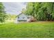 The home has a spacious lawn and an inviting stained-wood back deck with stair access at 2326 Westland Way, Acworth, GA 30102