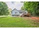 The house sits on a well-manicured lot and features a back porch with deck stairs at 2326 Westland Way, Acworth, GA 30102