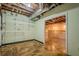 View of unfinished basement with exposed ductwork, hanging lights and open doorway at 2326 Westland Way, Acworth, GA 30102