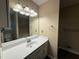 Bathroom featuring a large mirror, white vanity, and neutral paint at 2326 Westland Way, Acworth, GA 30102