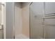Neutral bathroom with standing shower with glass door and towel rack at 2326 Westland Way, Acworth, GA 30102