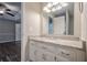 Bathroom featuring granite countertop, vanity with storage and views to main bedroom at 2326 Westland Way, Acworth, GA 30102