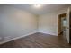 Bedroom featuring neutral paint, laminate flooring and a doorway leading to another room at 2326 Westland Way, Acworth, GA 30102