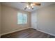 Bedroom featuring neutral paint, laminate flooring and a ceiling fan at 2326 Westland Way, Acworth, GA 30102