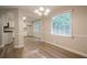 Dining room with a view into the kitchen, hardwood floors, and natural light at 2326 Westland Way, Acworth, GA 30102