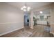 Dining room with hardwood floors looking into the kitchen and living room at 2326 Westland Way, Acworth, GA 30102