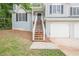 Beautiful home with front stairs leading to the entrance, complemented by a two-car garage and well-manicured lawn at 2326 Westland Way, Acworth, GA 30102
