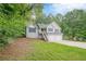 Charming home with a two-car garage, front stairs, and well-maintained landscaping at 2326 Westland Way, Acworth, GA 30102