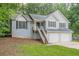Charming home with a two-car garage, front stairs, and well-maintained landscaping at 2326 Westland Way, Acworth, GA 30102