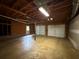Spacious two-car garage featuring exposed ceiling, providing ample parking and storage at 2326 Westland Way, Acworth, GA 30102