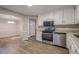 Kitchen looking into the dining room, with stainless steel appliances and granite counters at 2326 Westland Way, Acworth, GA 30102