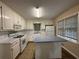 Traditional kitchen with tiled floors and white appliances at 2326 Westland Way, Acworth, GA 30102