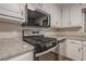 Close-up of kitchen featuring stainless steel appliances and granite countertops at 2326 Westland Way, Acworth, GA 30102