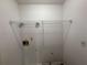 Functional laundry room with overhead shelving for efficient storage and organization solutions at 2326 Westland Way, Acworth, GA 30102