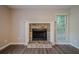Living room featuring a stone fireplace, neutral paint, and hardwood floors at 2326 Westland Way, Acworth, GA 30102