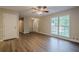 Living room with large window, hardwood floors, and neutral paint at 2326 Westland Way, Acworth, GA 30102