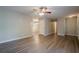 Bright living room features wood flooring, ceiling fan, and neutral paint colors at 2326 Westland Way, Acworth, GA 30102