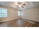 Spacious main bedroom with a ceiling fan, laminate flooring and two windows at 2326 Westland Way, Acworth, GA 30102