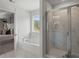 Primary bathroom with separate shower and tub at 286 Abbotts Crossing Cir, Conyers, GA 30094