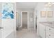 Well-lit bathroom with double vanity, tiled floors, shower and bathtub at 286 Abbotts Crossing Cir, Conyers, GA 30094