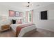 Bedroom features a shiplap accent wall, stylish nightstands, and natural light at 286 Abbotts Crossing Cir, Conyers, GA 30094