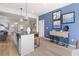 Stylish kitchen with an island and seating adjacent to dining and living spaces at 286 Abbotts Crossing Cir, Conyers, GA 30094