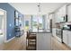 Stylish kitchen with stainless steel appliances, granite countertops, island with seating, and backyard access at 286 Abbotts Crossing Cir, Conyers, GA 30094