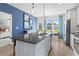 Kitchen area featuring island, stainless appliances, and access to the backyard and bedroom at 286 Abbotts Crossing Cir, Conyers, GA 30094