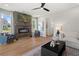 Cozy living room showcasing modern fireplace, wood floors, comfortable seating, and plenty of natural light at 286 Abbotts Crossing Cir, Conyers, GA 30094