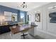 Home office features a large modern desk, stylish lighting, and chic decor at 286 Abbotts Crossing Cir, Conyers, GA 30094