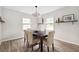 Bright dining room with hardwood floors, neutral paint, and built-in shelving at 4527 Sims Ct, Tucker, GA 30084