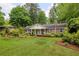 Charming brick home features a large front yard with lush landscaping at 4527 Sims Ct, Tucker, GA 30084