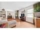 A bright living room features hardwood floors, built-in bookshelves, and a comfortable sectional sofa at 4527 Sims Ct, Tucker, GA 30084