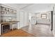 Spacious living area with hardwood floors, a bar area, and an open concept kitchen at 4527 Sims Ct, Tucker, GA 30084