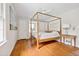 The main bedroom is bright with natural light and a four-poster bed at 4527 Sims Ct, Tucker, GA 30084