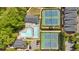 Aerial view of neighborhood amenities including a swimming pool and tennis courts at 5407 Waters Edge Trl, Roswell, GA 30075