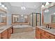 Bright bathroom boasts double vanities, jetted tub, and a walk-in shower at 5407 Waters Edge Trl, Roswell, GA 30075