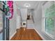 Bright foyer with hardwood floors, staircase, and fresh neutral paint at 5407 Waters Edge Trl, Roswell, GA 30075