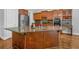 Gourmet kitchen with granite countertops, a large island, and custom cabinets at 5407 Waters Edge Trl, Roswell, GA 30075