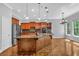 Spacious kitchen with a large island, stainless steel appliances, and wood cabinets at 5407 Waters Edge Trl, Roswell, GA 30075
