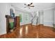 Open living room with hardwood floors, fireplace and staircase at 5407 Waters Edge Trl, Roswell, GA 30075
