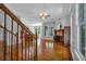 Open-concept living room featuring hardwood floors and fireplace at 5407 Waters Edge Trl, Roswell, GA 30075