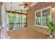 Inviting covered patio featuring serene view of the wooded backyard at 5407 Waters Edge Trl, Roswell, GA 30075