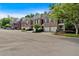 A row of well-maintained brick townhomes in a quiet neighborhood at 5407 Waters Edge Trl, Roswell, GA 30075