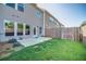 Fenced backyard featuring a grass lawn and concrete patio space at 1216 Foxcroft Ln, Cumming, GA 30041