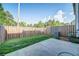 Backyard featuring a patio area, privacy fence, and freshly mowed grass at 1216 Foxcroft Ln, Cumming, GA 30041