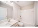 Bright bathroom featuring a well-lit vanity, toilet and a bathtub with white tile at 1216 Foxcroft Ln, Cumming, GA 30041