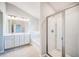 Modern bathroom featuring a double vanity, tub, and a separate shower stall at 1216 Foxcroft Ln, Cumming, GA 30041