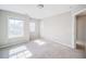 Inviting bedroom with soft carpet, natural light, and neutral walls at 1216 Foxcroft Ln, Cumming, GA 30041