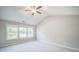 Bright bedroom with multiple windows and neutral-colored walls with plush carpeting at 1216 Foxcroft Ln, Cumming, GA 30041